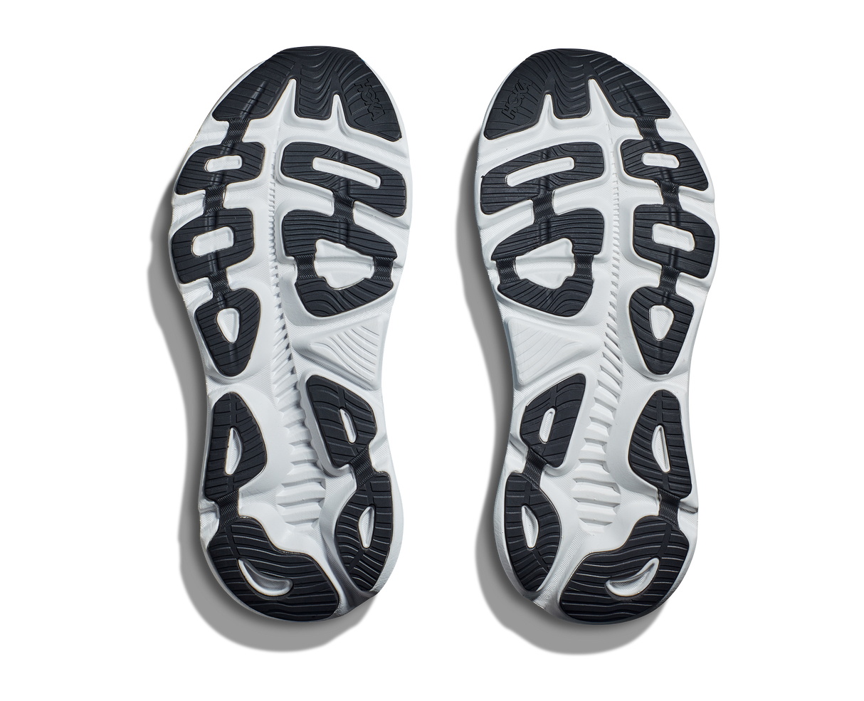 White running shoes with black sole pattern on a white background