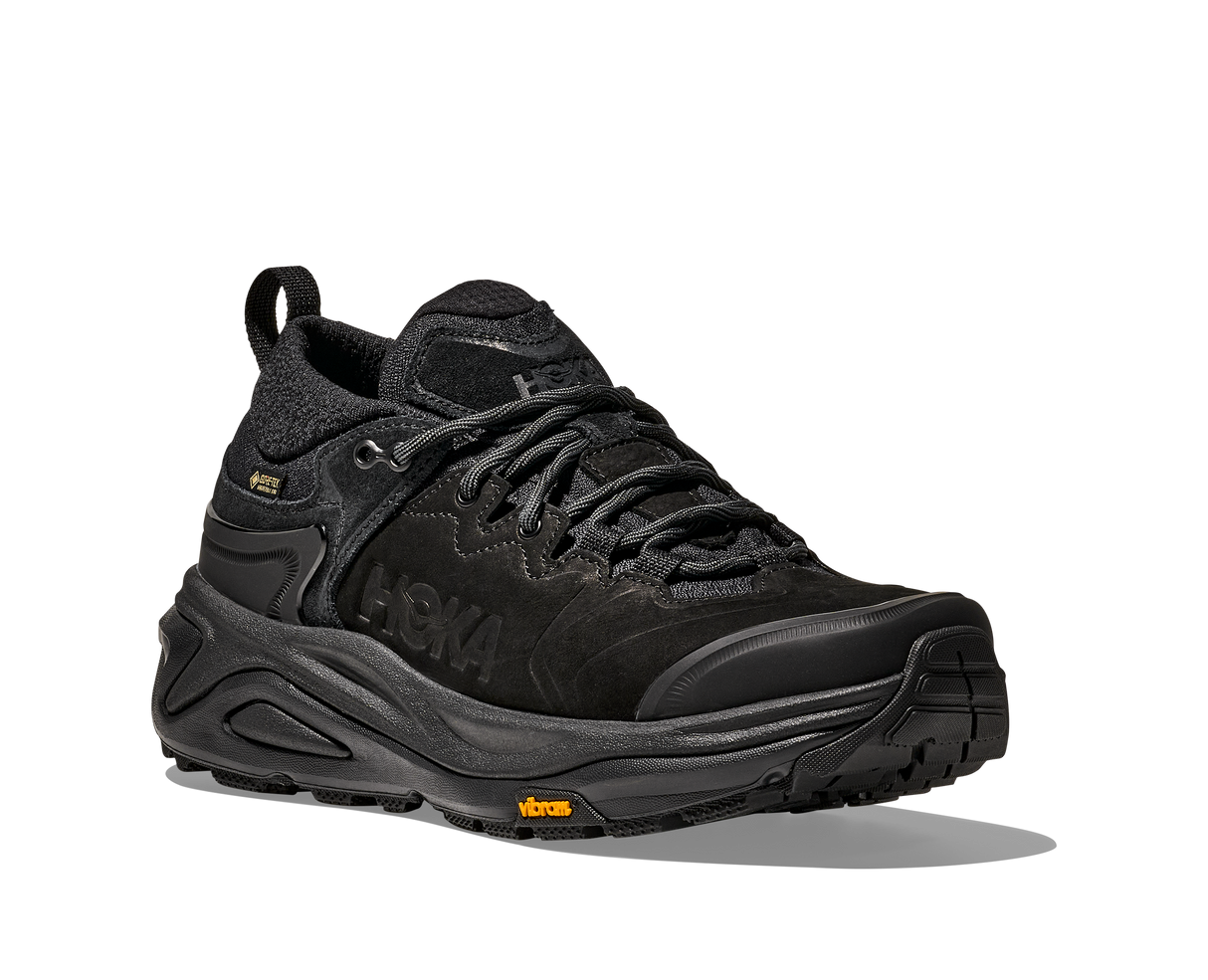 Black hiking shoe with a textured sole on a white background