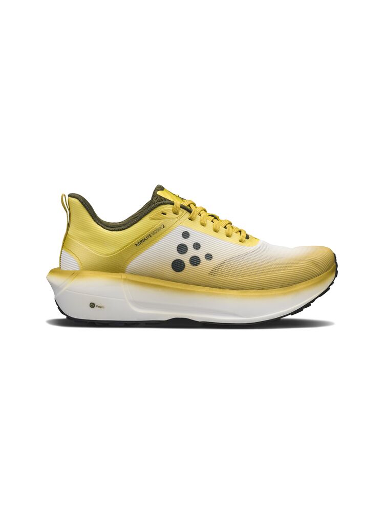 Yellow running shoe with a white sole on a white background