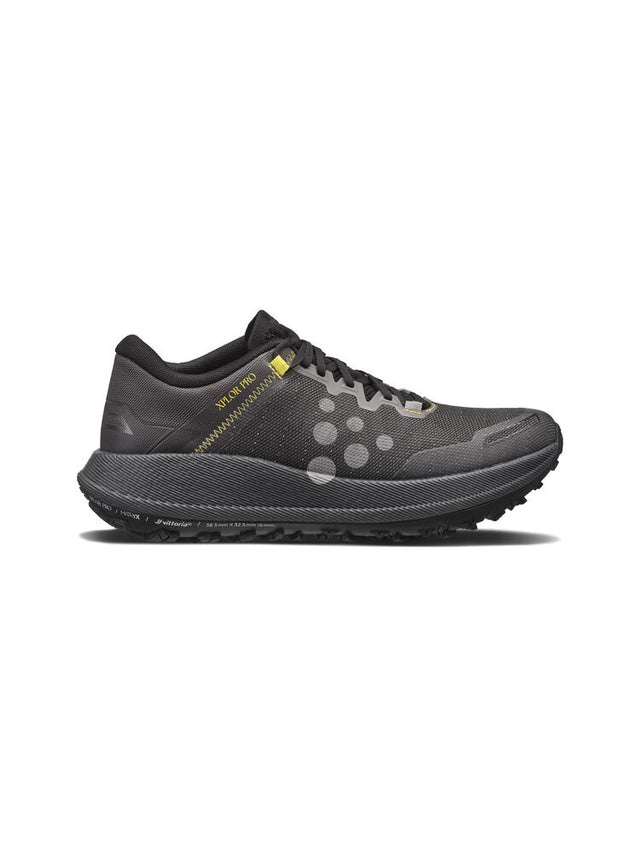 Black trail running shoe on a white background