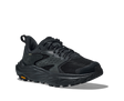 Black athletic shoe with orange Vibram logo on sole on a white background