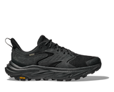 Black hiking shoe with orange Vibram logo on a white background