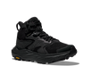 Black hiking boot with orange Vibram logo on sole on a white background