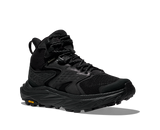 Black hiking boot with orange Vibram logo on sole on a white background