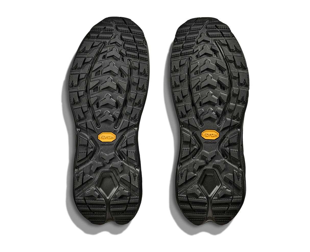 Black shoe soles with a Vibram brand logo on a white background