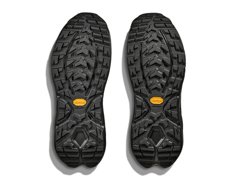 Black shoe soles with a Vibram brand logo on a white background