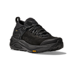 Black hiking shoe with a textured sole on a white background