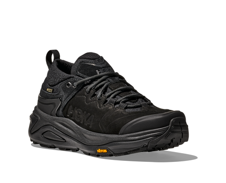 Black hiking shoe with a textured sole on a white background
