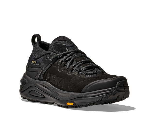 Black hiking shoe with a textured sole on a white background