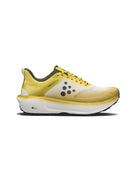 Yellow running shoe with a white sole on a white background