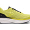 Yellow running shoe with black accent and white sole on a white background