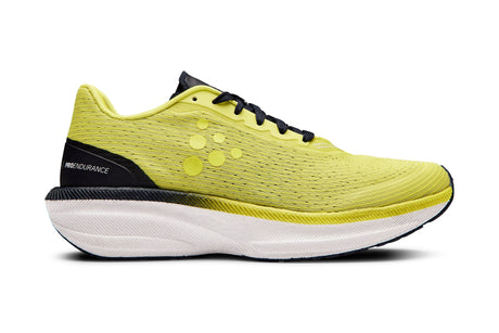 Yellow running shoe with black accent and white sole on a white background