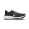 Black running shoe with white sole on a white background