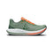Green running shoe with orange accents on a white background