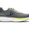 Grey running shoe with yellow accent and white sole on a white background