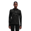 A woman wearing a black weather jacket with reflective elements on the sleeves and chest.