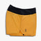 A pair of orange with black waistband lightweight shorts suitable for running or training.